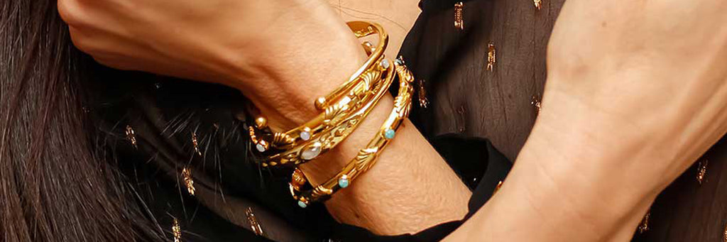 Woman wearing stacking gemstone bangles