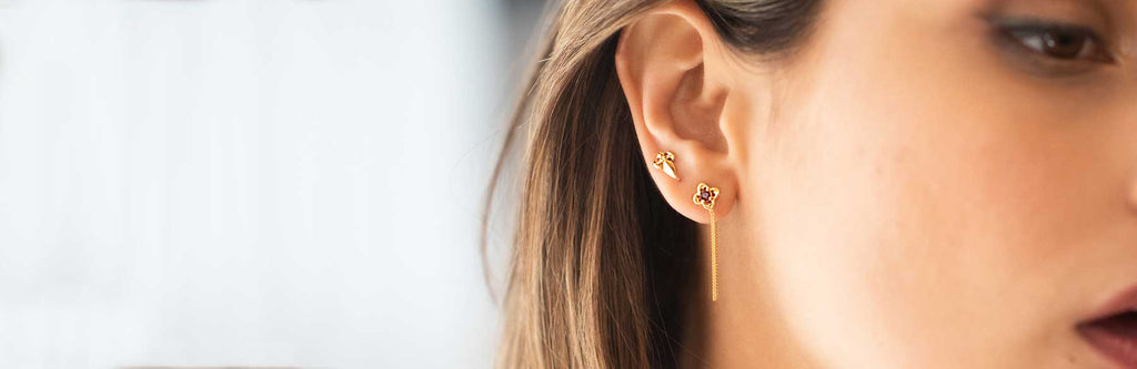 Woman wearing vermeil stud earrings