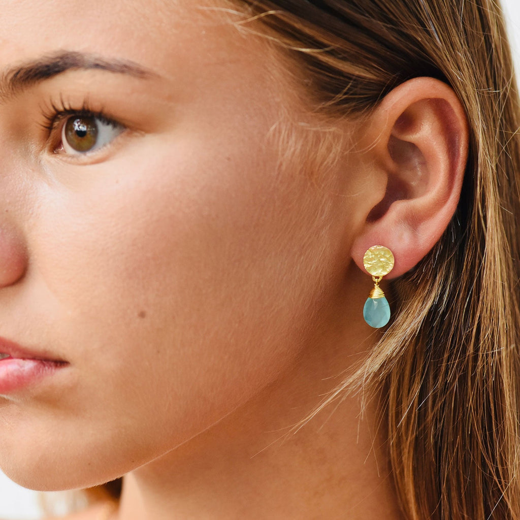 Model wearing Azuni Aqua chalcedony drop stone earrings 