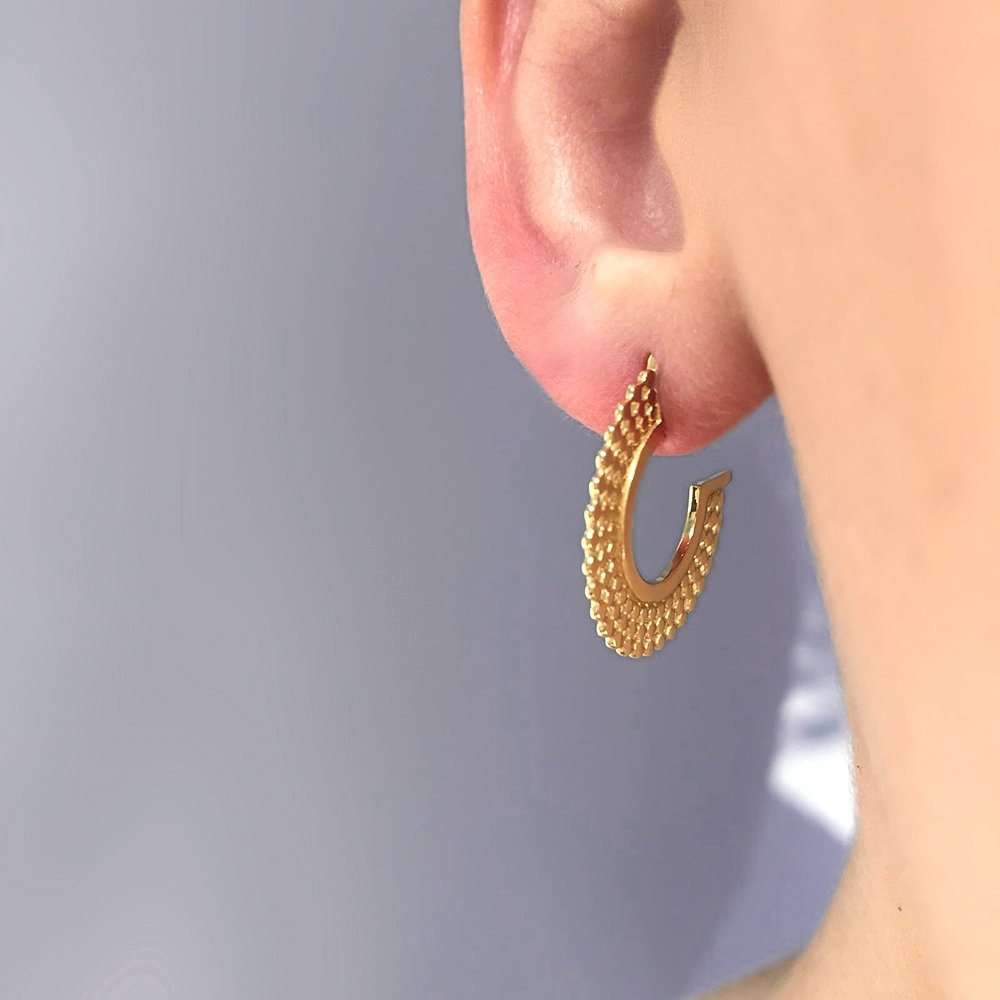 Model wearing Small gold bead hoop earrings, close up view, 18 karat yellow gold, by Azuni London