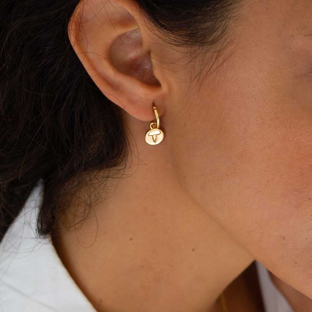 18 kt gold vermeil hoops with coin charm drops engraved with Western style steer heads . Azuni London