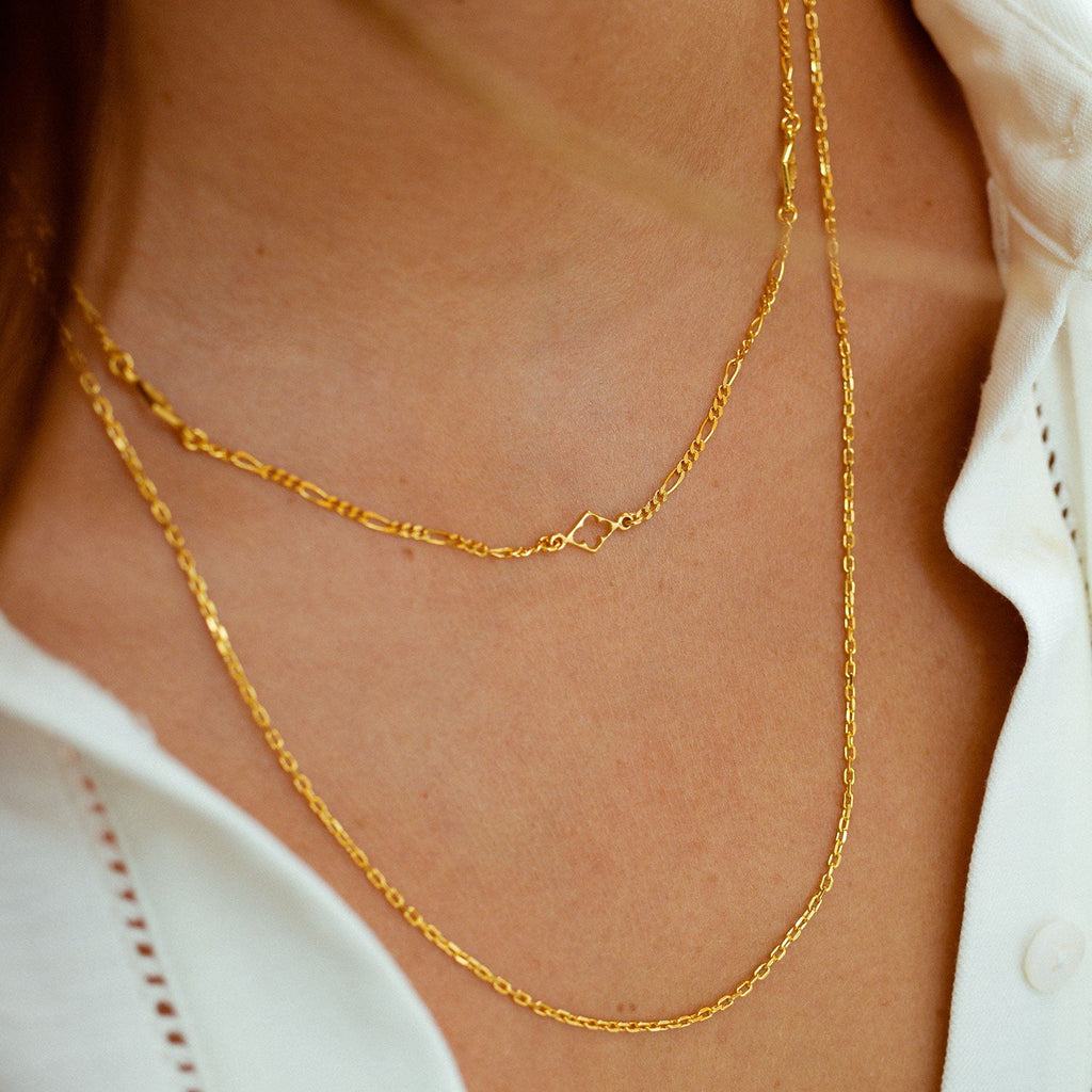 Long gold vermeil Figaro chain with diamond and clover motifs by Azuni 